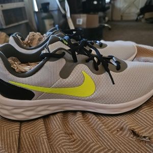 Brand new, never worn. Nike Revoltion gym shoes. Size 10.